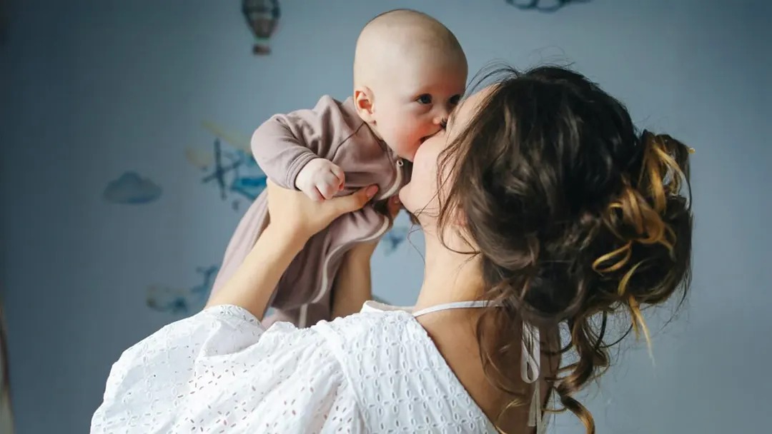 Mother embracing her baby, representing Mater Filius maternity home support